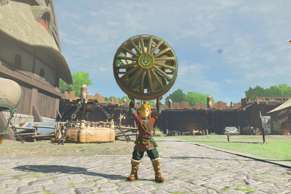 An image of Link in The Legend of Zelda: Tears of the Kingdom holding a fan over his head. 