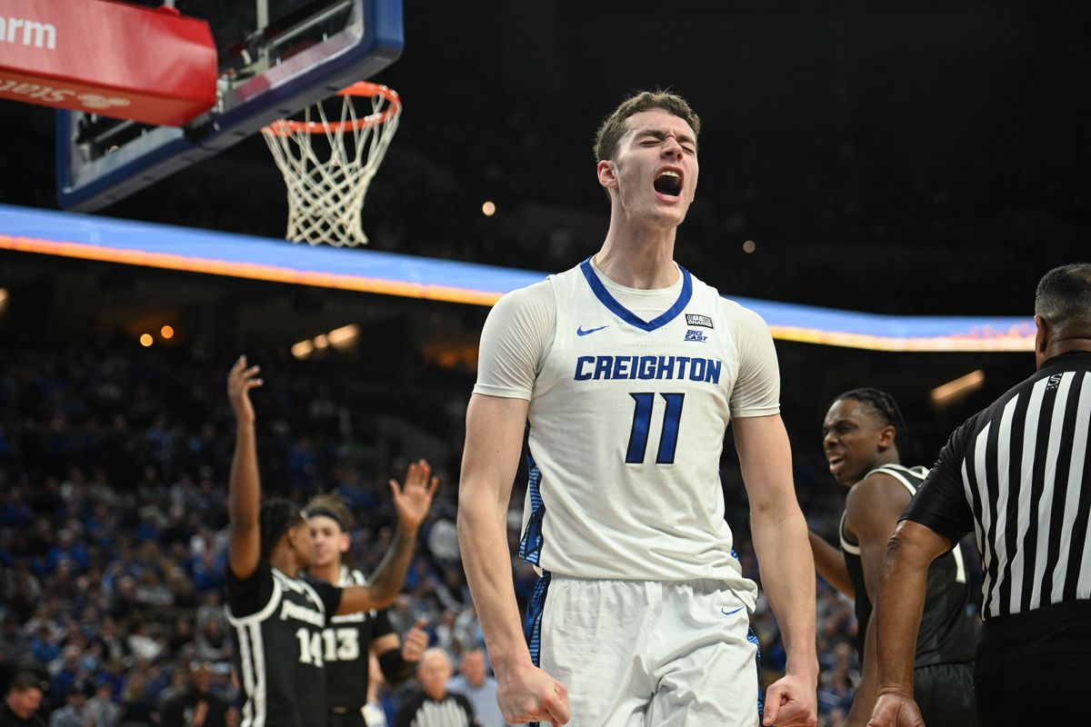 Creighton Bluejays center Ryan Kalkbrenner (11) reacts after scoring and being fouled against the Providence Friars in the second half at CHI Health Center Omaha. Mandatory Credit: Steven Branscombe
