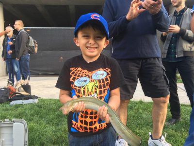 Richie Garcia with the American eel he caught in October 2017 from the Chicago River.<br>Provided