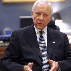 In this Thursday, June 28, 2012 photo, Sen. Orrin Hatch, R-Utah, talks with The Associated Press at his office on Capitol Hill in Washington. With his re-election to a seventh term all but assured, Hatch can think about his legacy. He’s very clear about what he wants: a deal that restructures the tax code while also slowing and even stopping the government’s accumulation of debt. To get it, he says he’ll practice the art of compromise. (AP Photo/Cliff Owen)