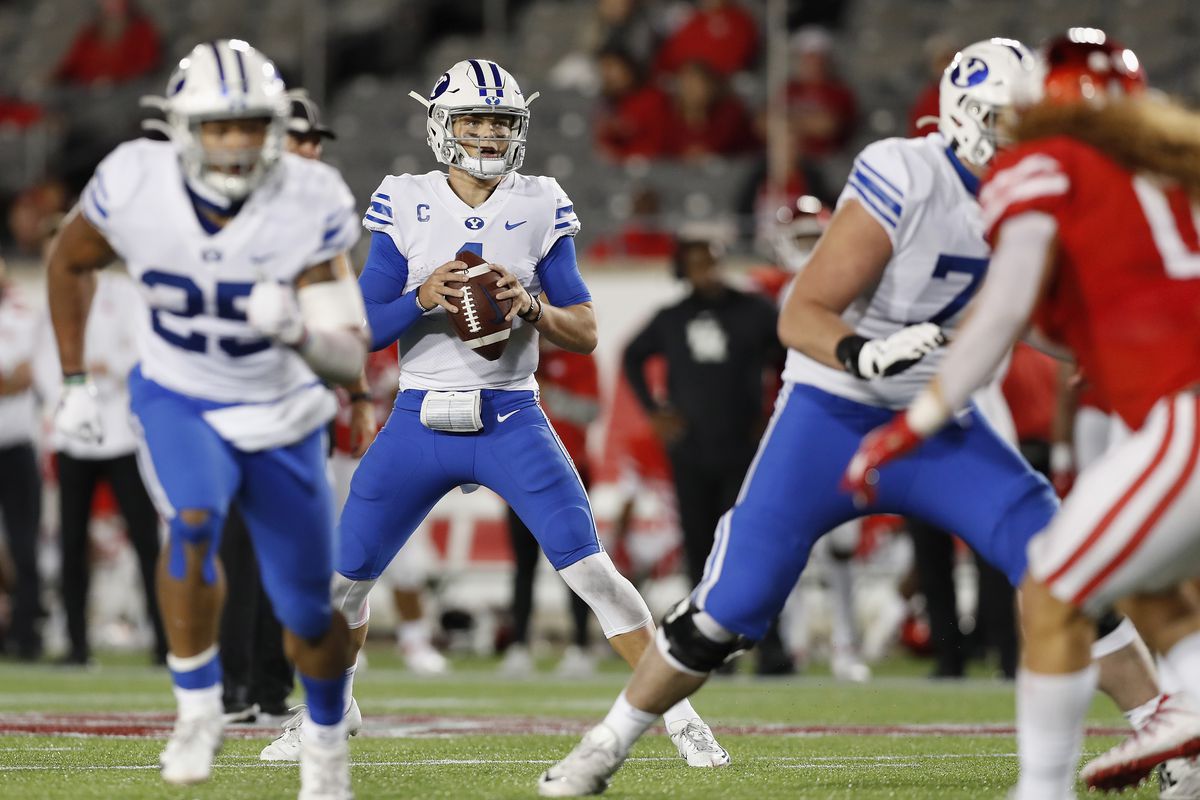 Zach Wilson of the BYU Cougars looks to pass against the Houston Cougars in the second half at TDECU Stadium on October 16, 2020 in Houston, Texas.