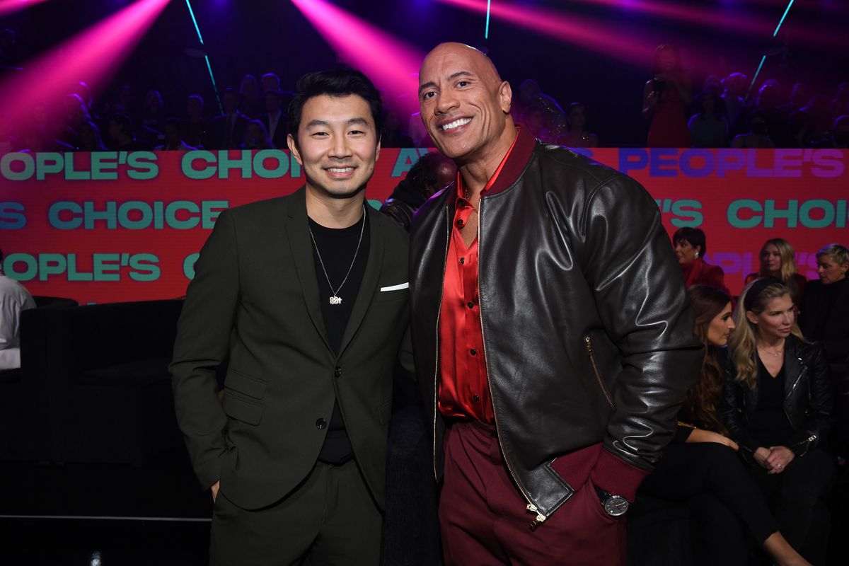 Simu Liu and Dwayne Johnson attend the People’s Choice Awards at Barker Hangar on December 07, 2021 in Santa Monica, California.