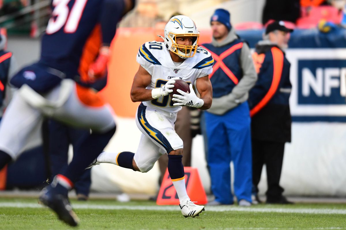 Los Angeles Chargers running back Austin Ekeler runs for a touchdown in second quarter against the Denver Broncos at Empower Field at Mile High