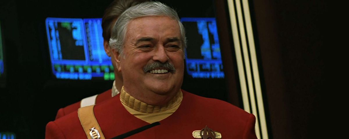 James Doohan smiling in dress uniform as Montgomery “Scotty” Scott in Star Trek VI: The Undiscovered Country.
