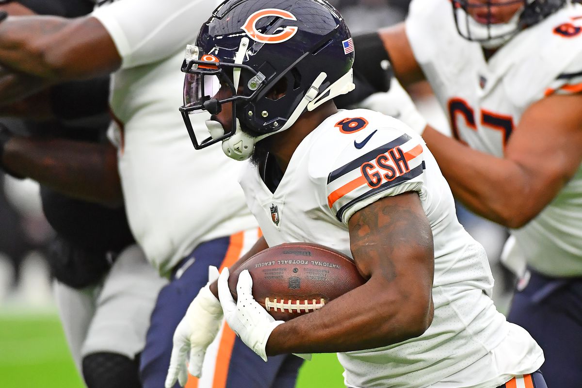 Chicago Bears running back Damien Williams (8) carries the ball during a game against the Las Vegas Raiders at Allegiant Stadium.