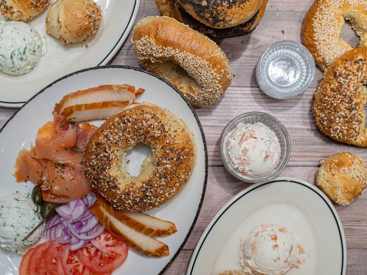 A platter of bagels, smoked fish, and cream cheese