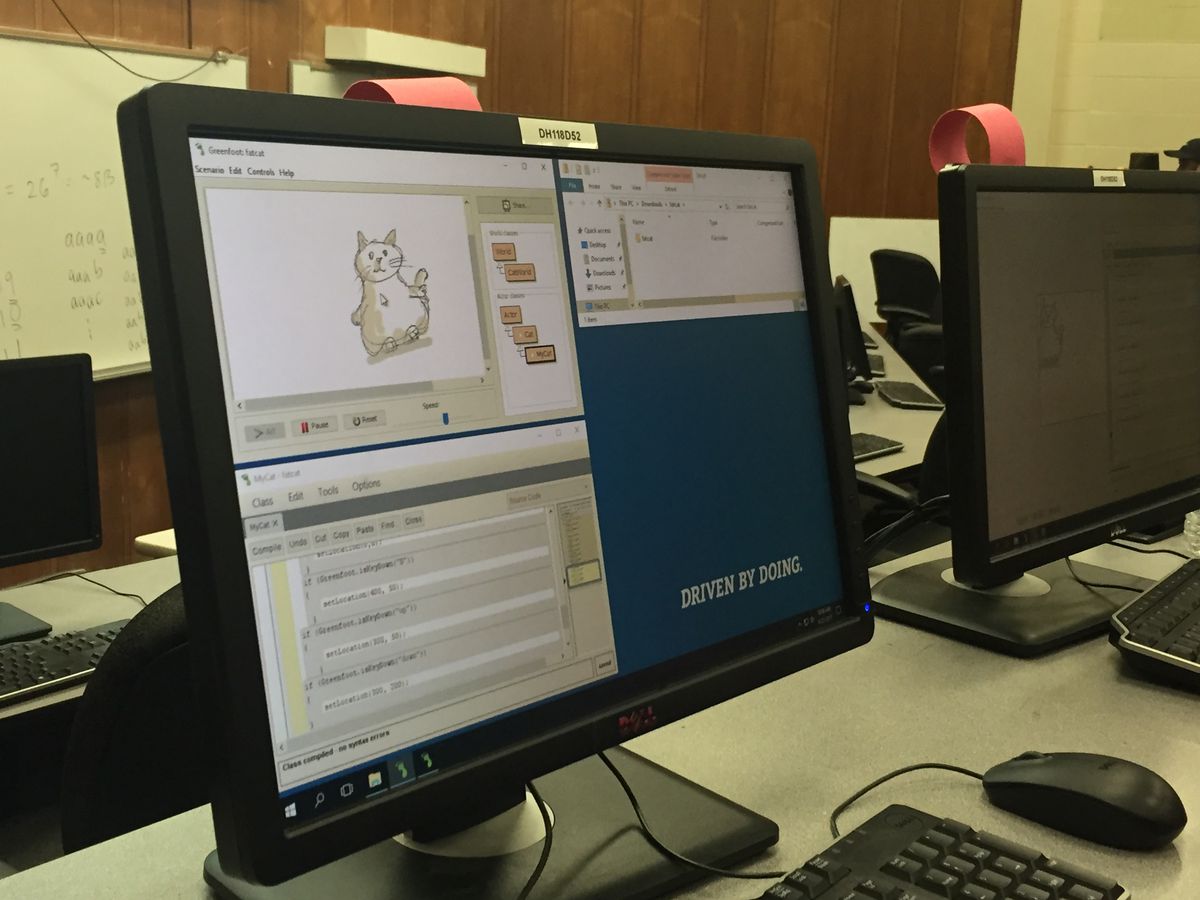 A simulated program allows campers to use computer coding to control the movements of a virtual cat.