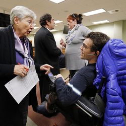 FILE - Rosemary Young, a House secretary, talks with public advocate Andrew Riggle of the Utah Disability Law Center before a House Judiciary Committee meeting at the Capitol in Salt Lake City on Wednesday, Feb. 3, 2016. A bill that backers say relieves loving families of unnecessary expenses of hiring attorneys for their disabled children in guardianship proceedings is before the Utah House of Representatives. Critics say HB101 could abridge potential wards' rights.