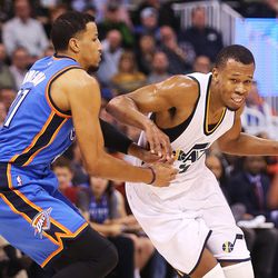 Utah Jazz guard Rodney Hood (5) drives on Oklahoma City Thunder forward Andre Roberson (21) as the Jazz and the Thunder play at Vivint Smart Home arena in Salt Lake City on Wednesday, Dec. 14, 2016.
