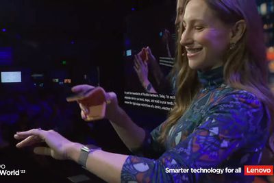 Screengrab of a woman about to cuff a bendable phone around her wrist over a metal strap.