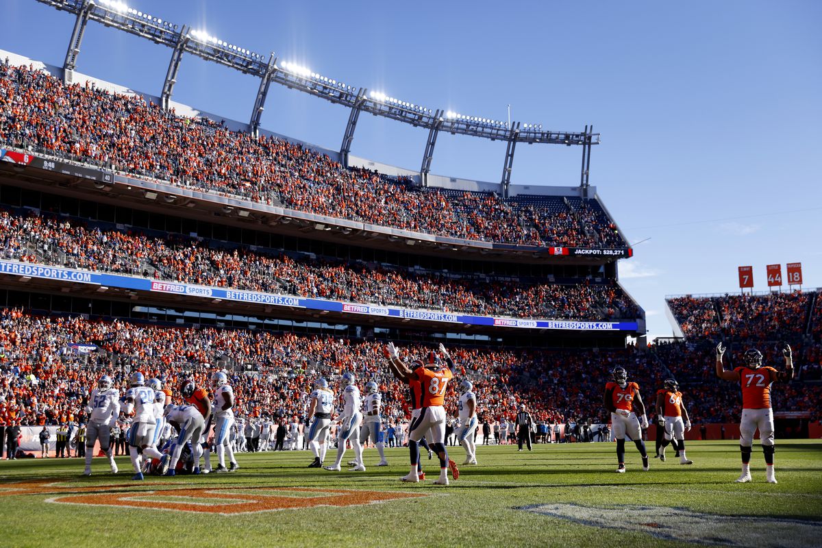A general view of Denver Broncos players celebrating after a touchdown by Melvin Gordon III #25 of the Denver Broncos in the first quarter against the Detroit Lions at Empower Field At Mile High on December 12, 2021 in Denver, Colorado.