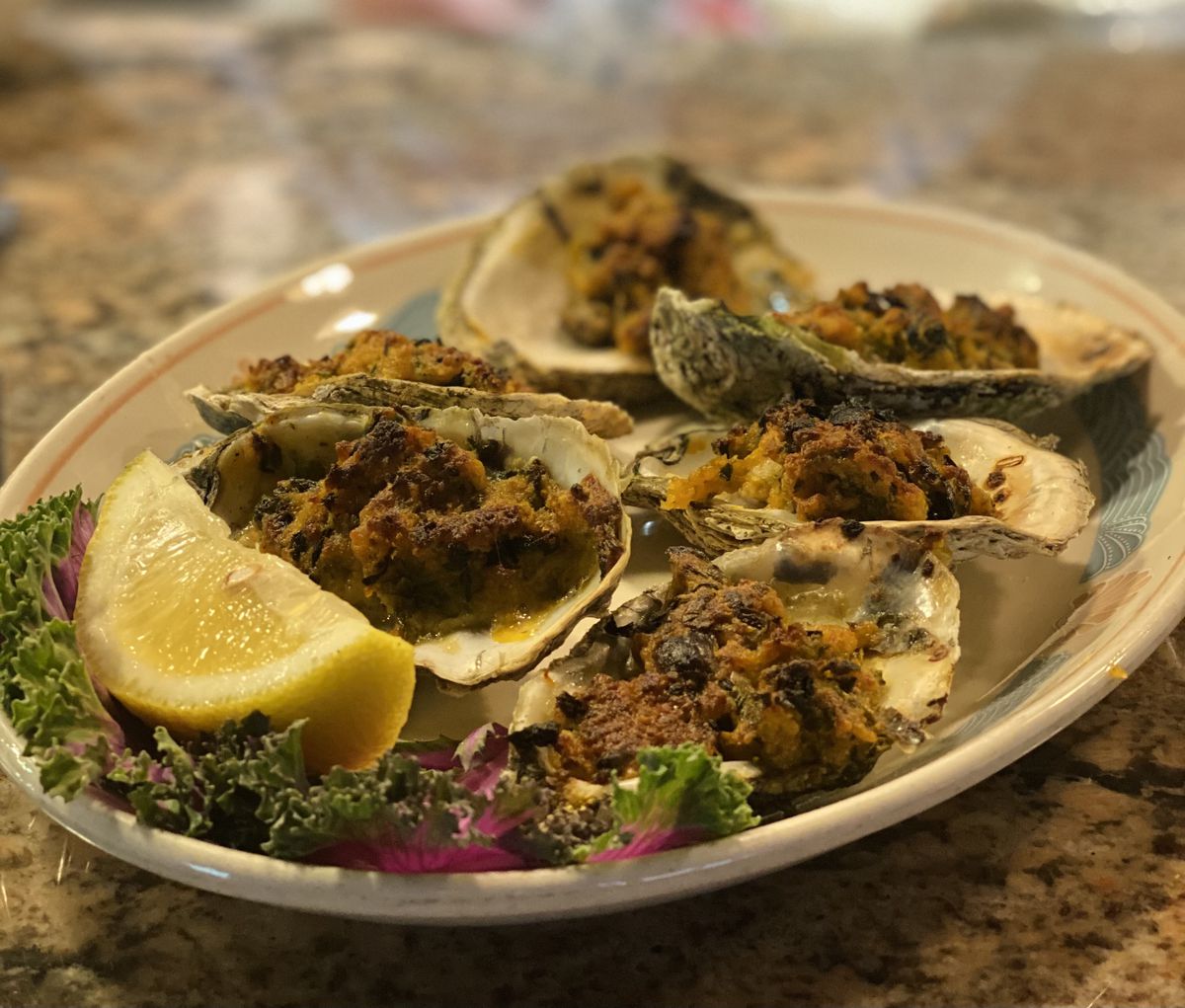 Oysters topped with breadcrumbs and butter.