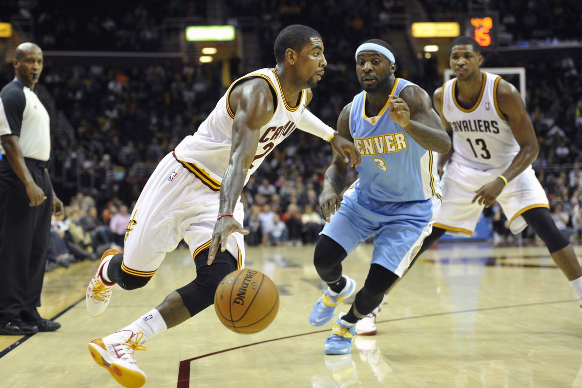 Kyrie Irving drives against Ty Lawson