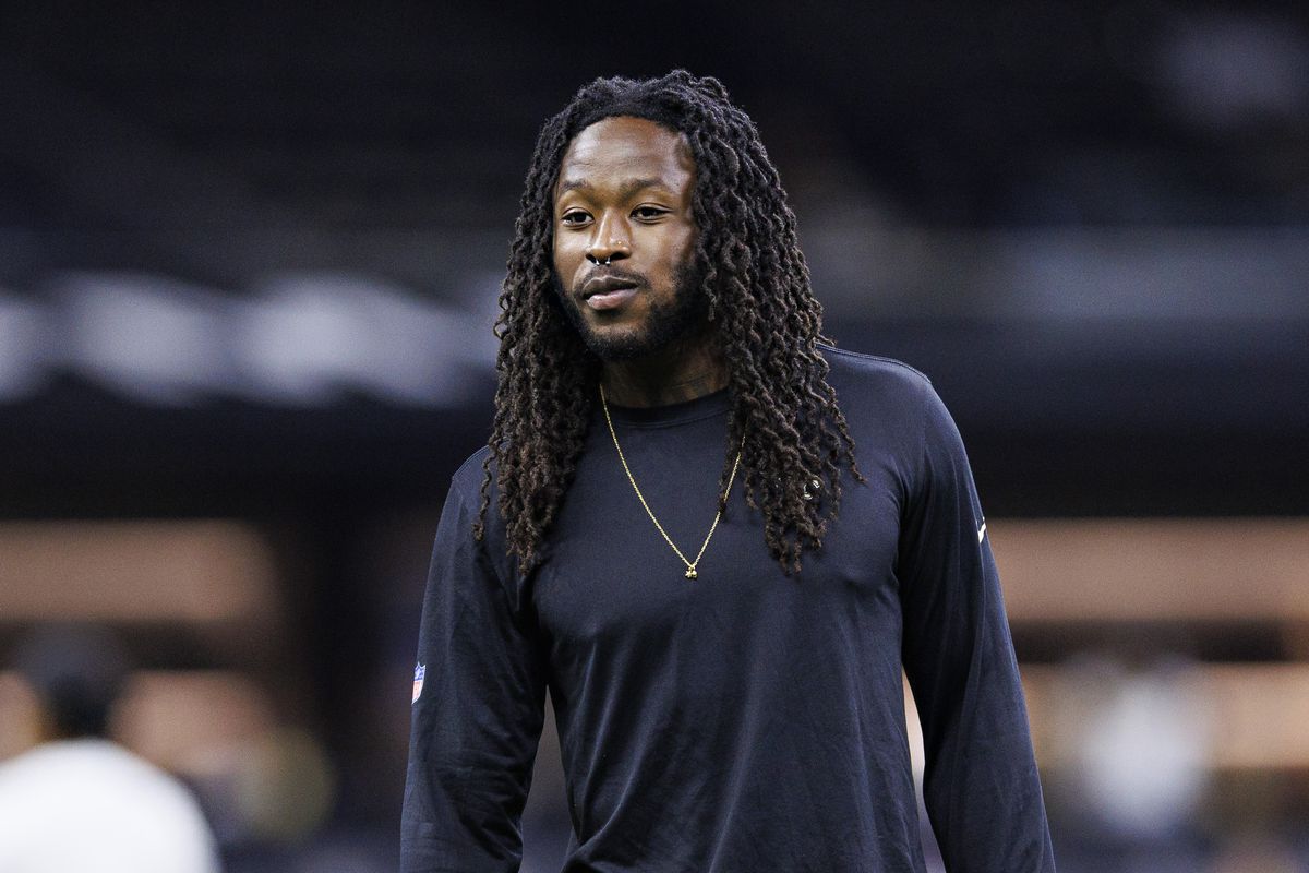 Alvin Kamara of the New Orleans Saints watches the team warm up before the preseason game against the Houston Texans at Caesars Superdome on August 27, 2023 in New Orleans, Louisiana. The Texans defeated the Saints 17-13.