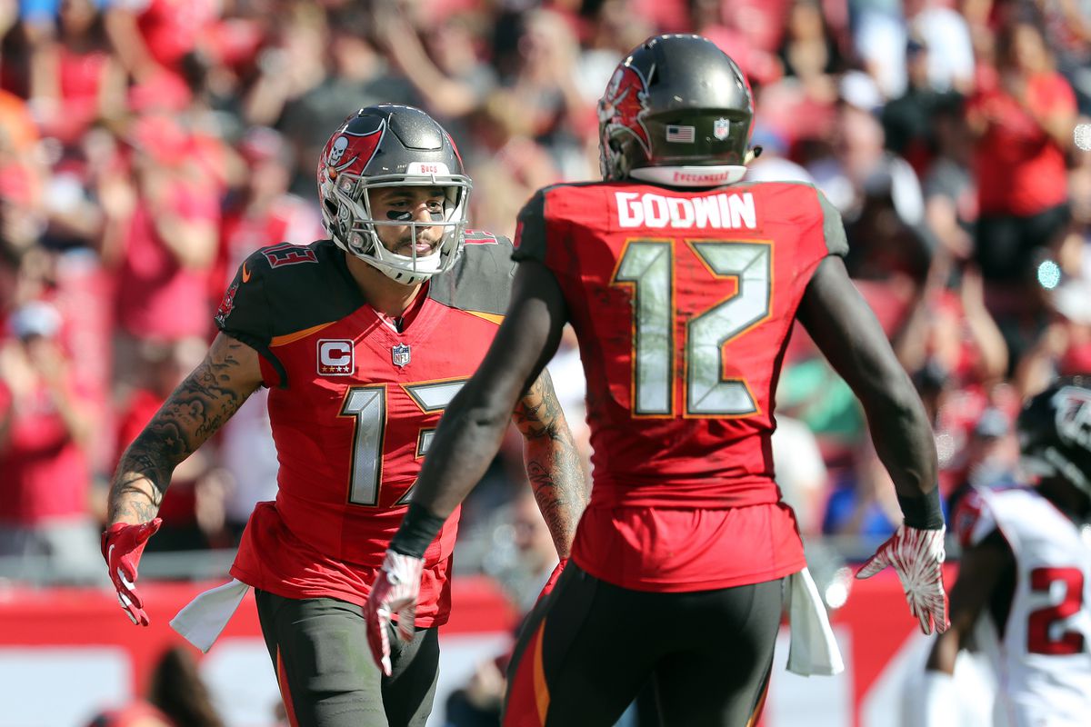 Tampa Bay Buccaneers wide receiver Mike Evans is congratulated by wide receiver Chris Godwin after catching a pass for a touchdown against the Atlanta Falcons during the first quarter at Raymond James Stadium.