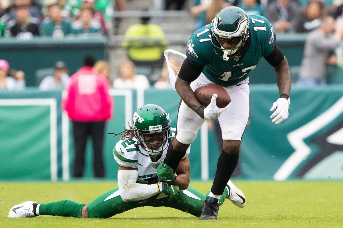 New York Jets cornerback Darryl Roberts tackles Philadelphia Eagles wide receiver Alshon Jeffery during the third quarter at Lincoln Financial Field.