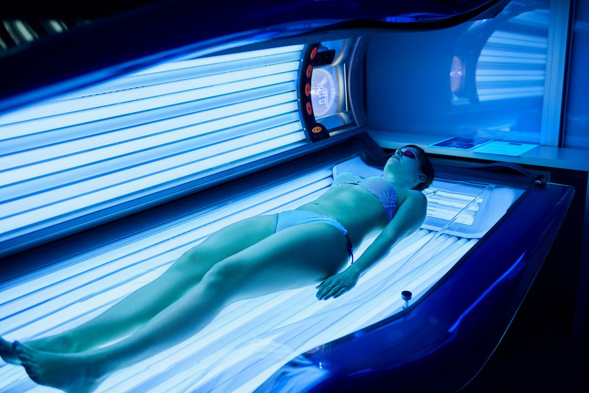 Many people believe it’s beneficial to sunbathe in a tanning bed to get a “base” tan before they started their summer sunbathing. It’s not. | stock.adobe.com