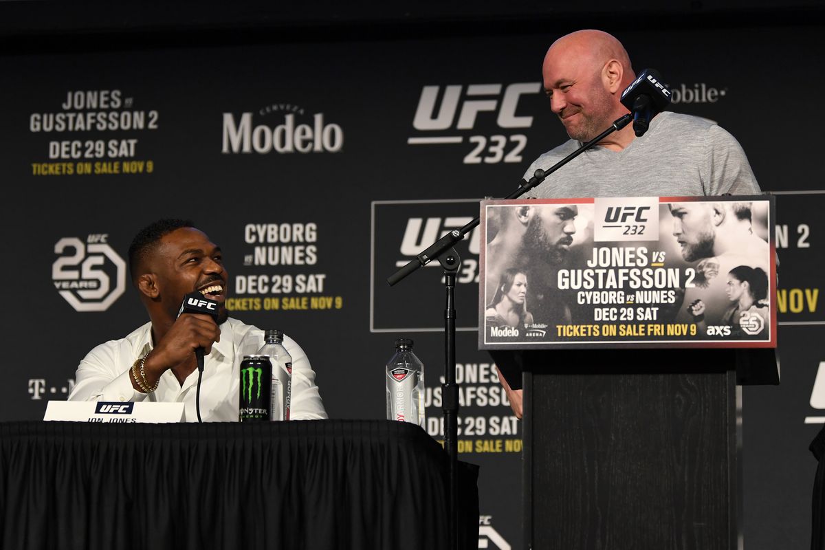 Jon Jones and Dana White share a few words during the UFC 232 press conference.