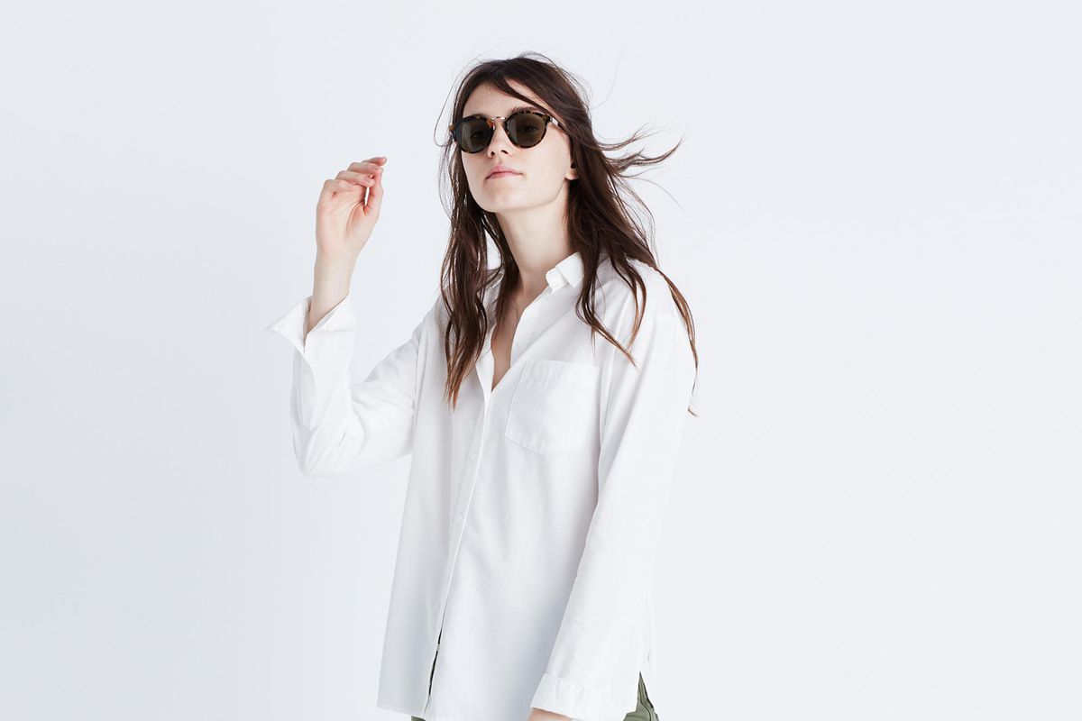 model in white oversized shirt