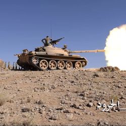 This frame grab from video provided by the Lebanese Army official website, a Lebanese army tank fires during a battle against Islamic State militants, on the outskirts of Ras Baalbek, northeast Lebanon, Sunday, Aug. 20, 2017. Sunday's gains come a day after the U.S.-backed army launched its biggest military operation yet against IS, who in 2014 gained a foothold along the tiny Mediterranean country's border with Syria. The Arabic Hashtag reads, "The Barren Mountains Dawn." (Lebanese Army Website via AP)