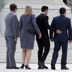 California's Proposition 8 plaintiffs, from left, Kris Perry, Sandy Stier, Paul Katami, and Jeff Zarrillo walk into the Supreme Court in Washington, Monday, June 24, 2013. 