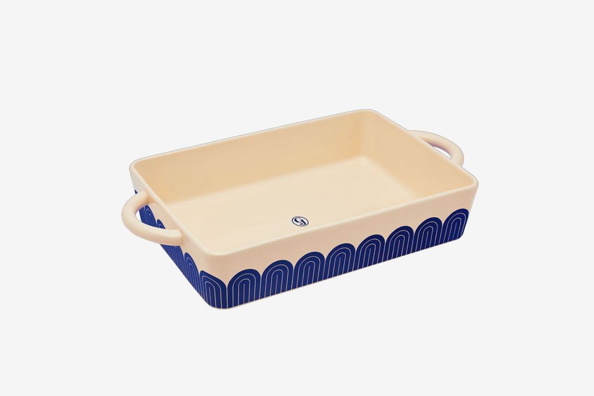 a casserole dish with a blue pattern around the side