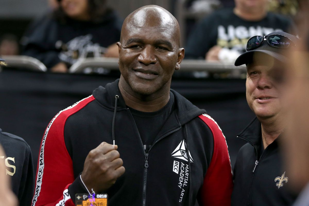 Former heavyweight boxing champion Evander Holyfield poses for pictures before a game between the New Orleans Saints and the Atlanta Falcons at the Mercedes-Benz Superdome.