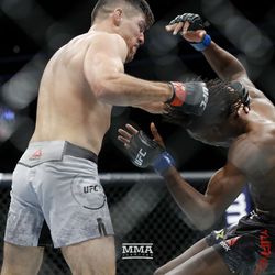 Vicente Luque knocks Jalin Turner down at UFC 229.