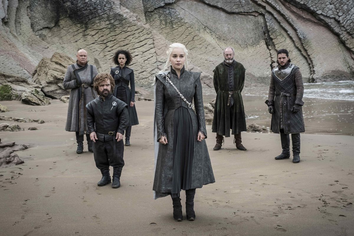 Game of Thrones characters standing on a beach.