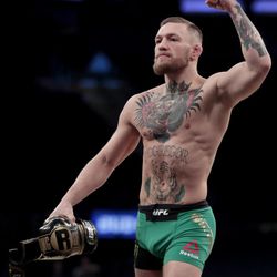 Conor McGregor gestures toward fans while working out ahead of his UFC 205 mixed martial arts bout against Eddie Alvarez during an open workout, Wednesday, Nov. 9, 2016, at Madison Square Garden in New York. McGregor will square off against Alvarez during their match on Saturday. 
