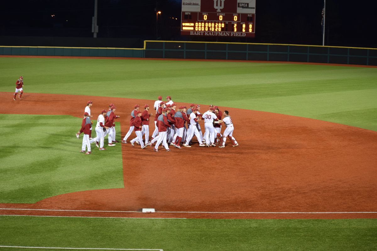 The Hoosiers celebrate Friday night's win after Luke Miller nailed the final out at the plate