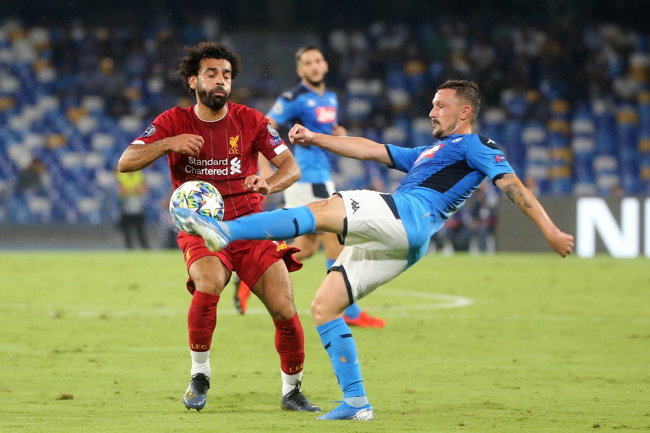 Napoli’s Portuguese defender Mario Rui (R) fights for the...