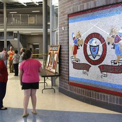 People tour the commons area of the new Granger High School on Saturday, June 1, 2013, in West Valley City.
