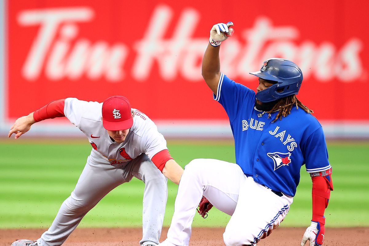 Vladimir Guerrero Jr. of the Toronto Blue Jays slides safely into second base against the St. Louis Cardinals at Rogers Centre on July 27, 2022 in Toronto, Ontario, Canada.