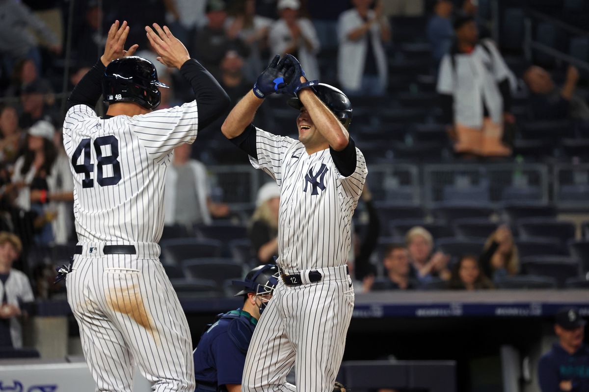 Anthony Rizzo and Isiah Kiner-Falefa of the New York Yankees celebrate after a home run during a game against the Seattle Mariners at Yankee Stadium on June 22, 2023, in New York, New York.