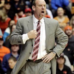 Utah coach Larry Krystkowiak calls out from the bench during the first half of his team's NCAA college basketball game against Oregon State in Corvallis, Ore., Thursday, Feb. 19, 2015. (AP Photo/Don Ryan)