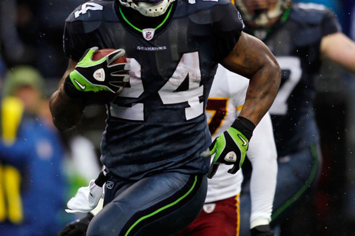 SEATTLE - NOVEMBER 27:  Marshawn Lynch #24 of the Seattle Seahawks runs for a touchdown against  the Washington Redskins on November 27, 2011 at CenturyLink Field in Seattle, Washington.  (Photo by Jonathan Ferrey/Getty Images)