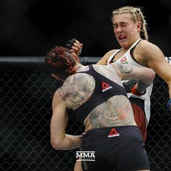 Cris Cyborg smacks Yana Kunitskaya at UFC 222.