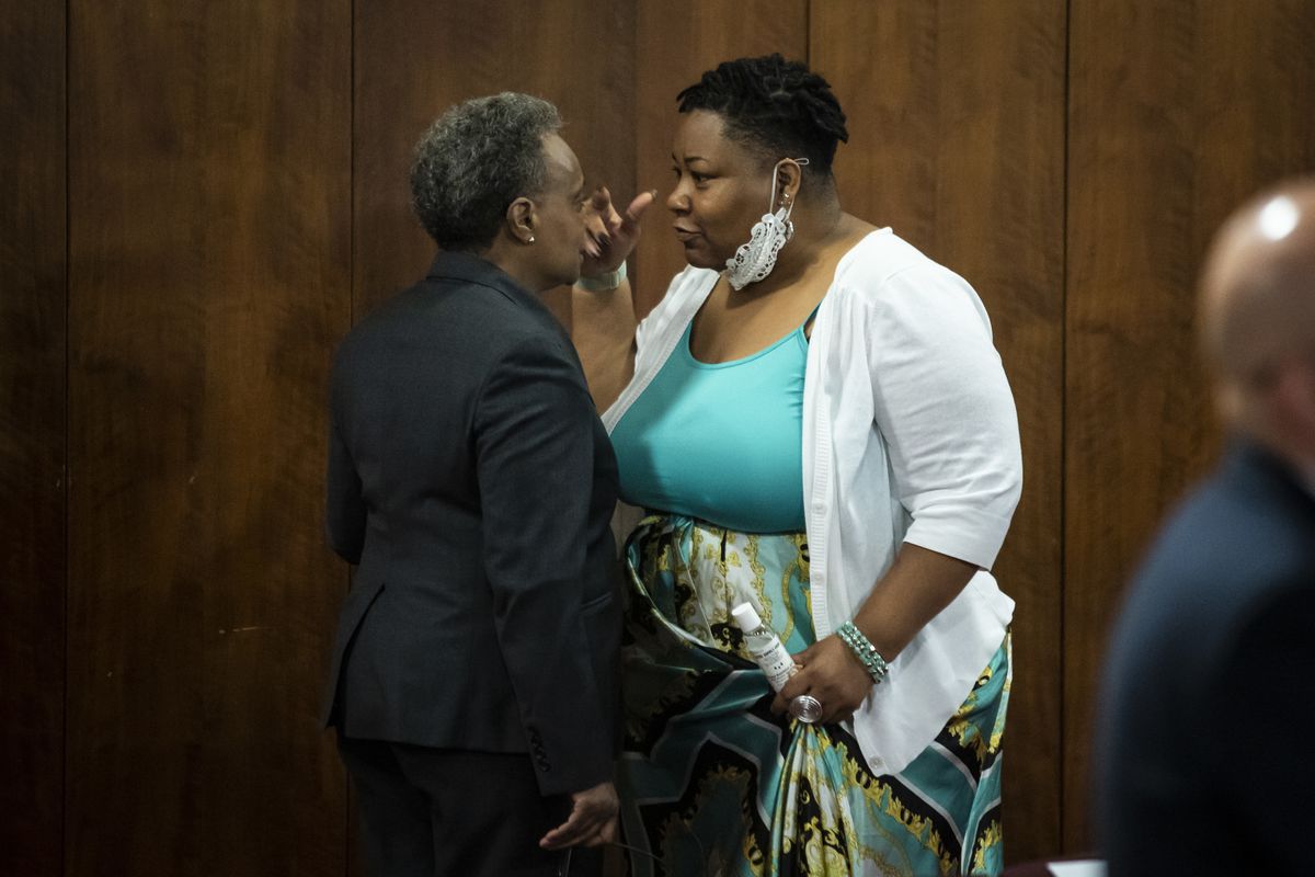 Mayor Lori Lightfoot and Ald. Jeanette Taylor (20th) in a heated discussion in the back of the Chicago City Council chambers on Wednesday before the Council meeting abruptly adjourned.