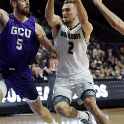 Utah Valley Wolverines guard Jake Toolson goes to the basket with Matt Jackson of Grand Canyon defending during the Western Athletic Conference basketball tournament in Las Vegas on Friday, March 9, 2018.