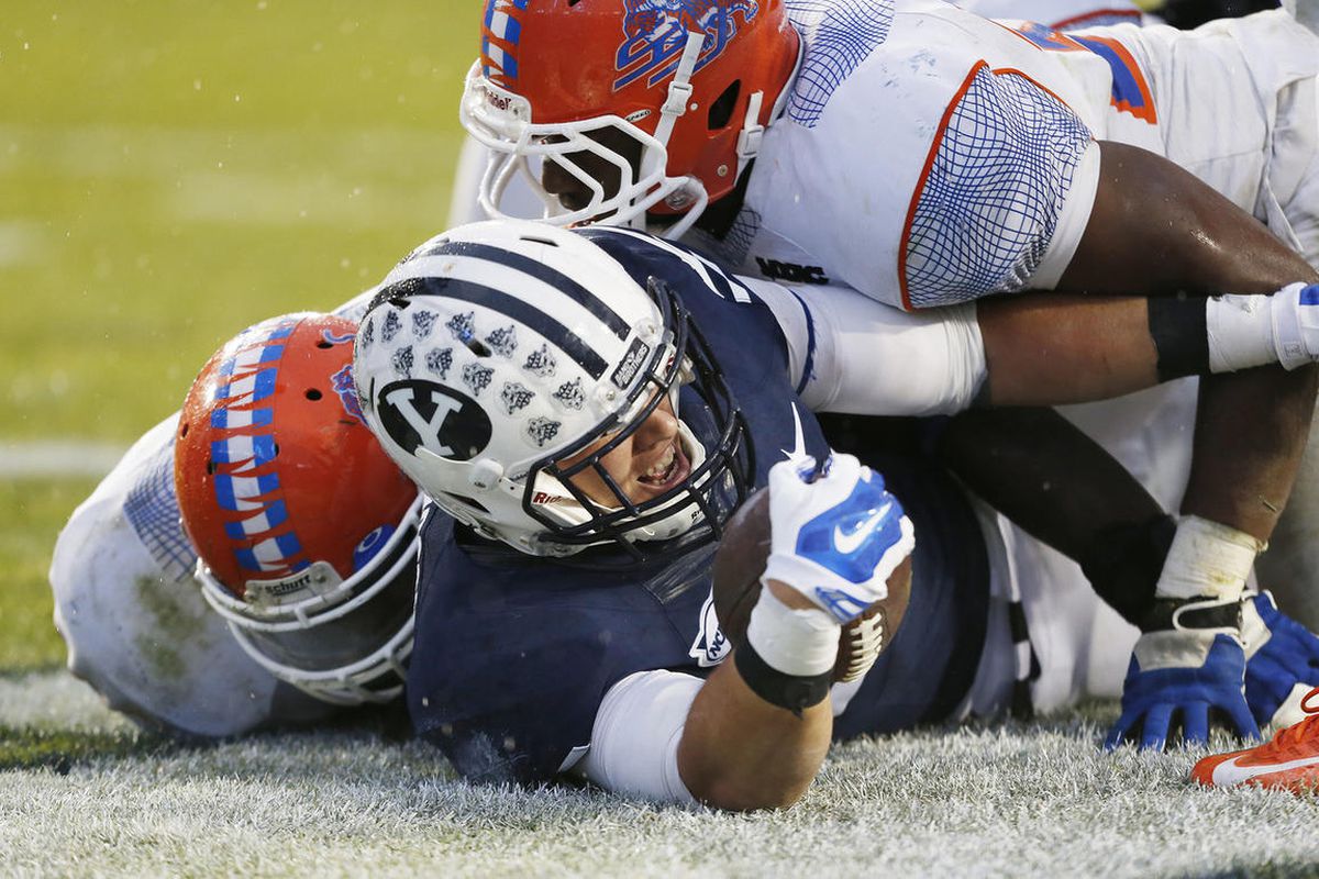 Brigham Young Cougars tight end Bryan Sampson (85) jumps on a fumble in the end zone for a touchdown  in Provo  Saturday, Nov. 22, 2014.   