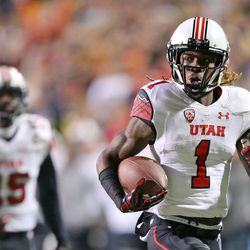 Utah Utes defensive back Boobie Hobbs runs for a touchdown during the first half of a football game against the Colorado Buffaloes at Folsom Field in Boulder, Colo., on Saturday, Nov. 26, 2016.