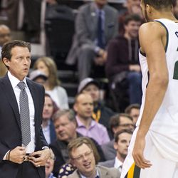 Utah head coach Quin Snyder talks with center Rudy Gobert (27) during the first half of an NBA basketball game against Golden State in Salt Lake City on Thursday, Dec. 8, 2016.