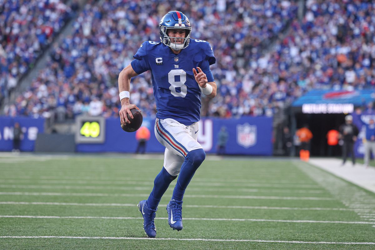 New York Giants quarterback Daniel Jones (8) scores a rushing touchdown during the second half against the Indianapolis Colts at MetLife Stadium.
