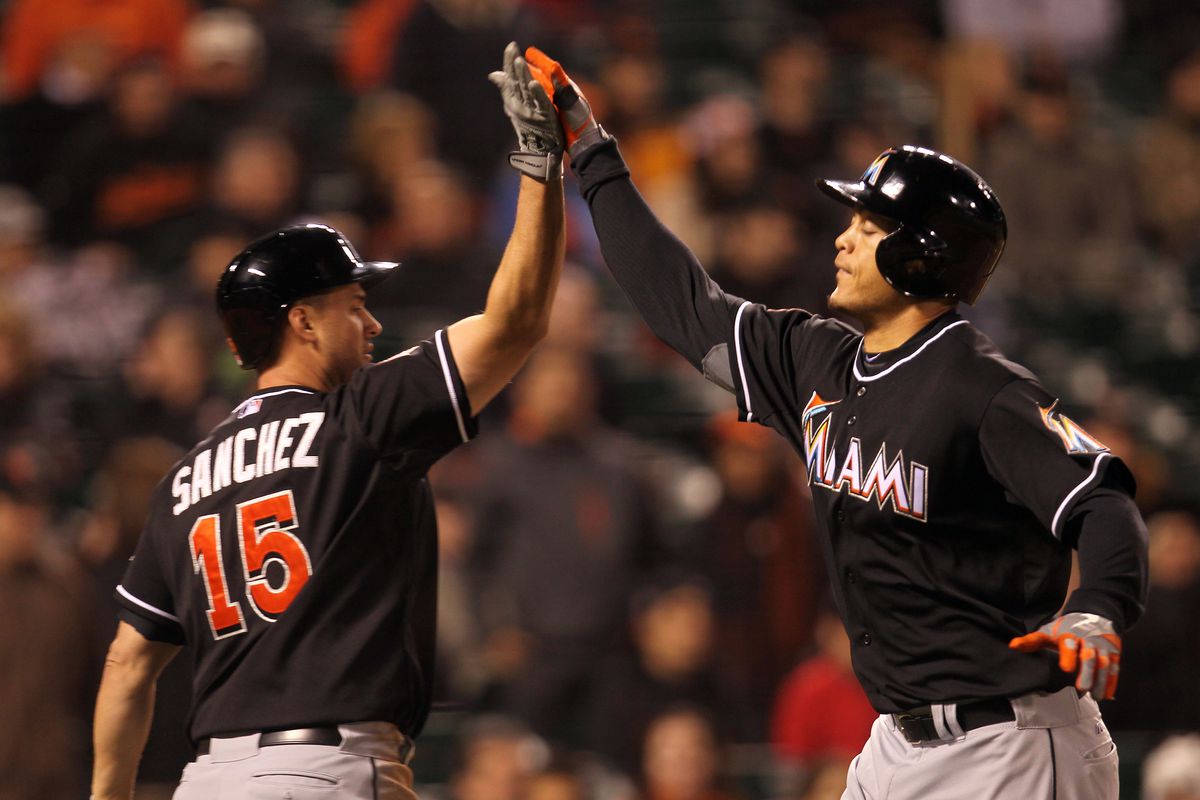 Miami Marlins’ Giancarlo Stanton, right, celebrates with Gaby Sanchez after hitting a solo home run off San Francisco Giants’ Santiago Casilla during the tenth inning of their game at AT&amp;T Park in San Francisco, Calif. on Wednesday, May 2, 2012. (Jane Ty