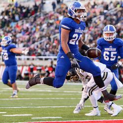 Bingham's Daniel Loua scores, putting Bingham up 14-10 over Lone Peak after the PAT, in the 5A football State Championship game at Rice-Eccles Stadium in Salt Lake City on Friday, Nov. 18, 2016. Bingham won the game, 17-10.