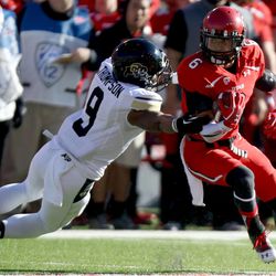 Colorado defensive back Tedric Thompson (9) tackles Utah wide receiver Dres Anderson (6) during the first half of a football game at the Rice-Eccles Stadium in Salt Lake City on Saturday, Nov. 30, 2013. Utah won 24-17.