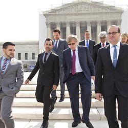 FILE - In this June 20, 2013 file photo, Chad Griffin, right, president of the Human Rights Campaign, leaves the Supreme Court, with Jeff Zarrillo, left, and Paul Katami, second from left, the plaintiffs in the California Proposition 8 case, and their attorney Ted Olson, center, in Washington. Proposition 8 is the California measure that banned same sex marriages. The U.S. Supreme Court is expected to issue a ruling that will determine the fate of California's voter-approved ban on same-sex marriages on Wednesday morning, June 26, 2013. (AP Photo/J. Scott Applewhite, File)