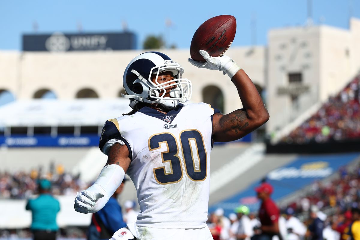 Todd Gurley #30 of the Los Angeles Rams throws the ball into the crowd after scoring a touchdown in the fourth quarter against the Tampa Bay Buccaneers at Los Angeles Memorial Coliseum on September 29, 2019 in Los Angeles, California.