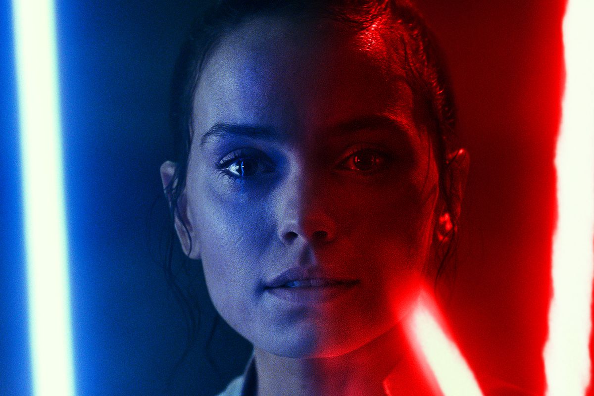 Rey lit by blue and red lightsabers from Star Wars: The Rise of Skywalker